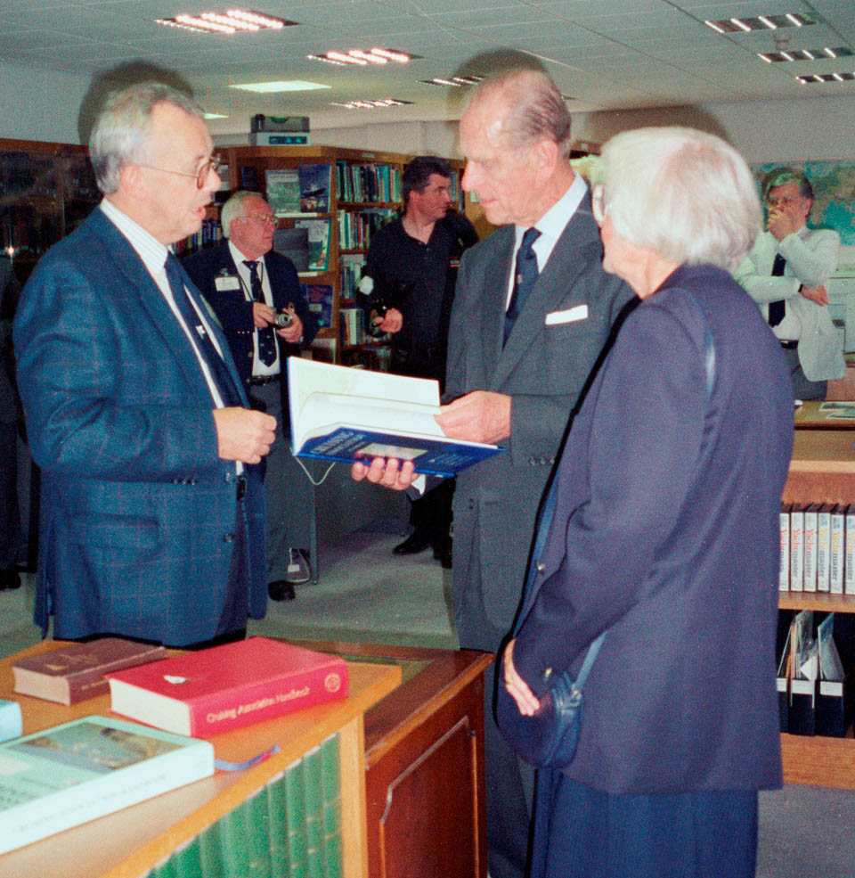Prince Philip is presented with the CA Handbook (the forerunner of the Almanac) by Stuart Bradley, Chair of the Handbook and Information Committee, in the presence of CA President Jean Andrews, on 22 July 1998